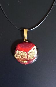 Red circle pendant with gold touches