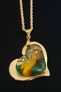 Green & yellow heart on gold medallion